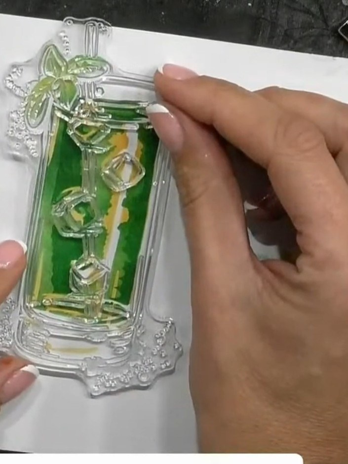 Step 6: Apply green ink through stencil three, pressing firmly to create darker tones and depth. Work the ink pad over