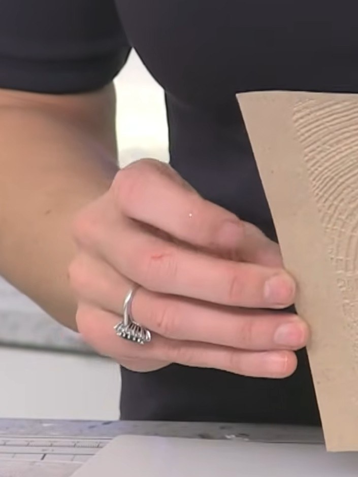 Step 4: Trim the embossed timber-textured cardstock to a smaller size suitable for your card design using a craft knif