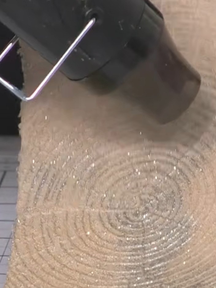 Step 9: Distress the edges of the embossed timber background piece using a black ink pad to add definition and prevent