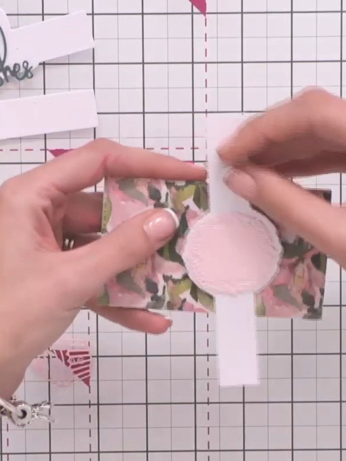 Step 7: Take a decorative belly band and wrap it around your completed gift card wallet to hold it closed.