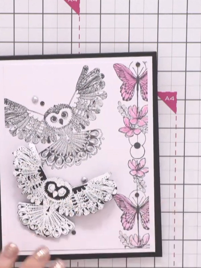 Step 3: Heat emboss a second owl stamp in white embossing powder onto black cardstock to create contrast. This will gi