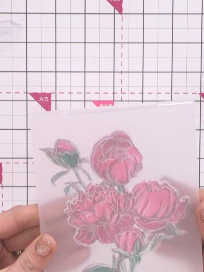 Step 3: Pinch the embossing folder together around your stamped image and run it through your die-cutting machine. Thi