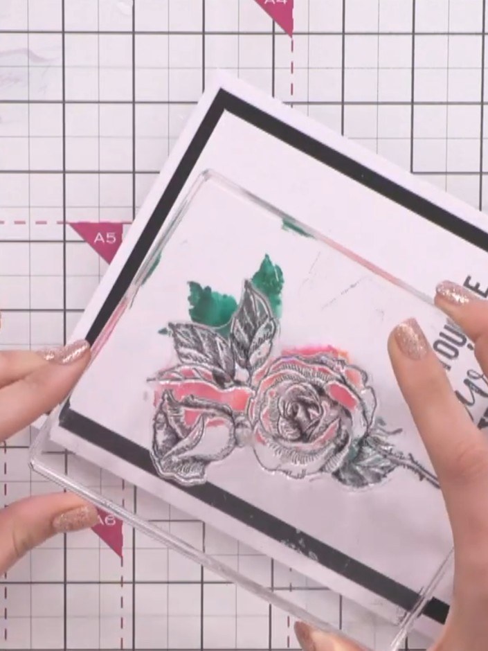 Step 6: Stamp the outline rose design over the watercoloured portion using a black ink pad. This will add detail and d