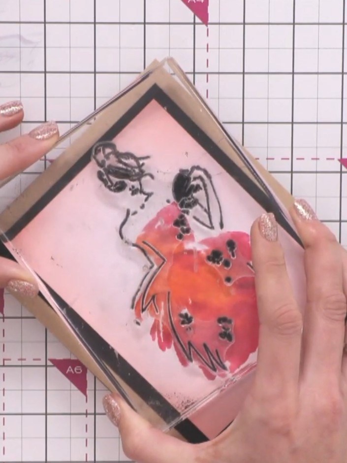Step 6: Ink up the outline stamp thoroughly with black or sparkly powder ink, ensuring even coverage across the entire