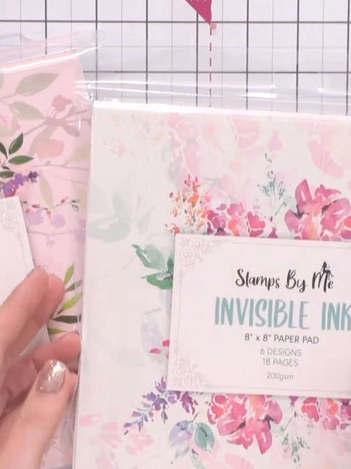 Step 1: Select one of the invisible ink paper pad sheets. These feature sepia-toned floral designs printed underneath 