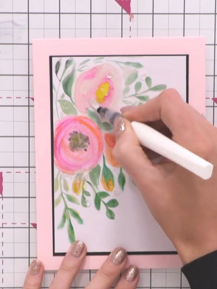 Step 4: Add your own creative touches to the watercolour design using additional colours. Use a white pen or marker to