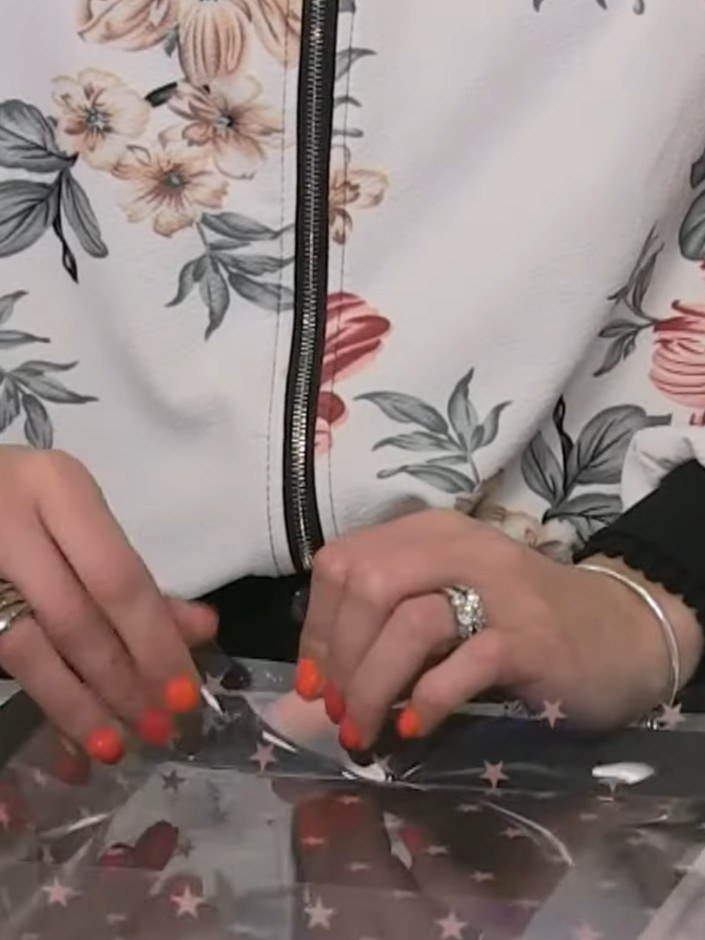 Step 7: Repeat the taping and folding process with your second acetate sheet to create the box lid. Ensure all four si