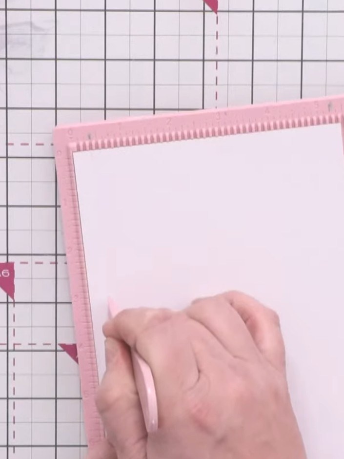Step 2: Using a scoreboard, score a grid pattern on all four sides of the white card. Start from the third notch in an