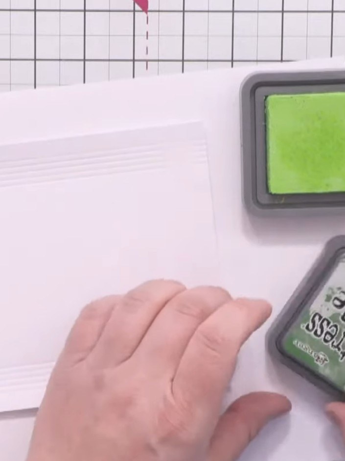 Step 4: Apply Distress Oxide inks in Twisted Citron (light green) and Mowed Lawn (darker green) to the scored grid pan