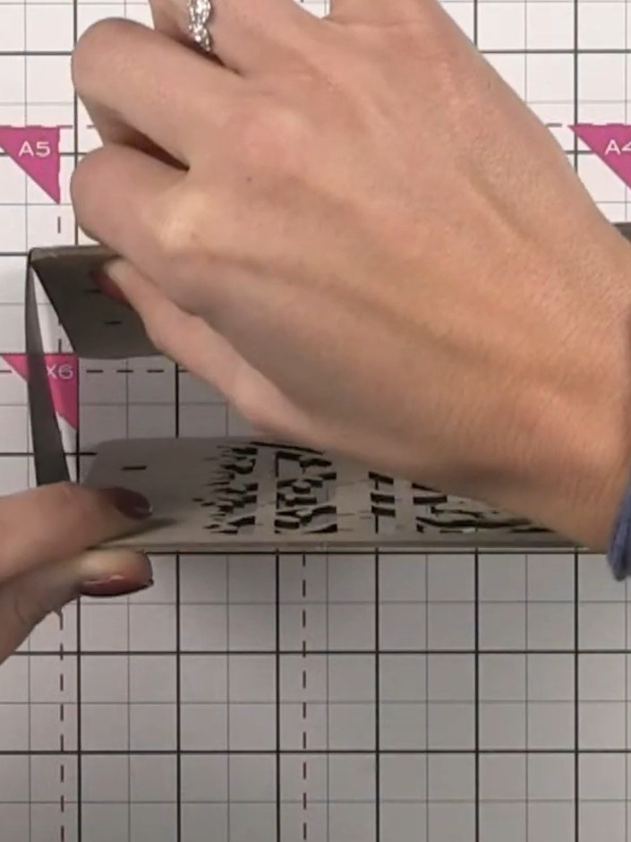 Step 3: Fold along all the scored lines on your grey cardstock pieces to create hinges. These folded hinges will hold 