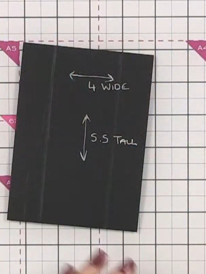 Step 4: Cut a piece of black cardstock measuring 5.5 inches tall by 4 inches wide for the first interior page.