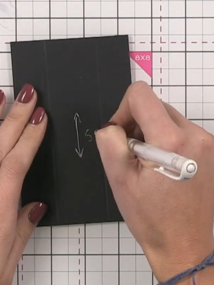 Step 6: Cut the next interior page from black cardstock to 5.5 inches tall by 3.5 inches wide. Score at 1 inch from ea