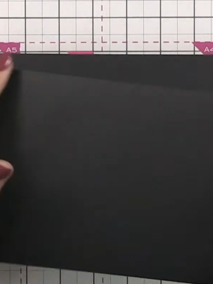 Step 1: Take a black cardstock page measuring 5.5 inches tall by 8 inches long.