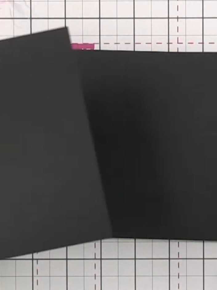 Step 2: Score a line 2 inches (5 cm) from the left edge of the black cardstock to create the fold line for your pocket