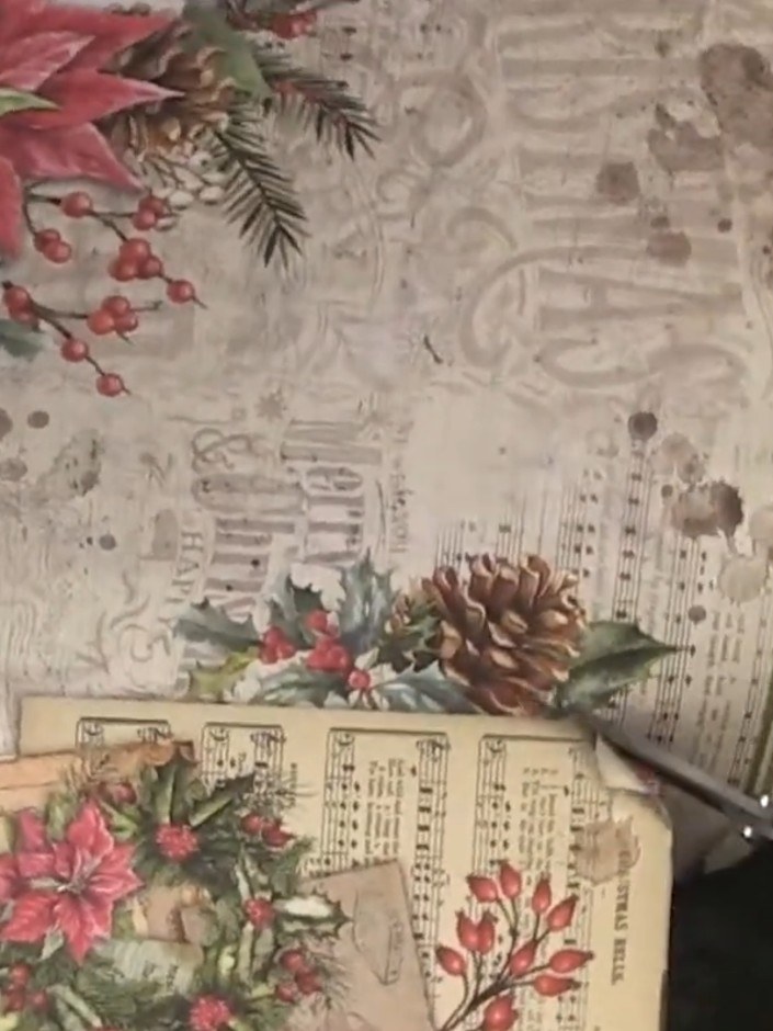 Step 3: Position the cut decorative paper on the front cover of the album, adjusting the placement to frame the design