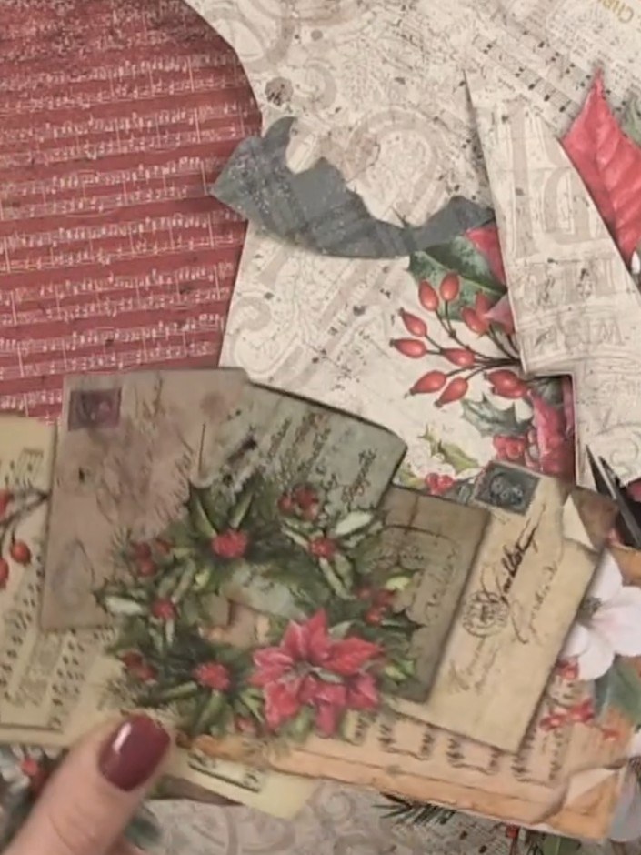 Step 4: Apply adhesive to the back of the patterned paper layer featuring the poinsettias and greenery. Position and a