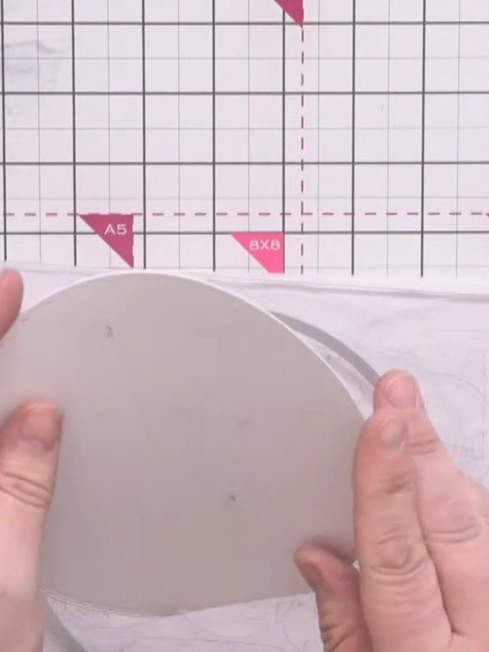 Step 3: Trim the back edge of the circular card flat to create a stable resting base so the bubble won't rock when sta