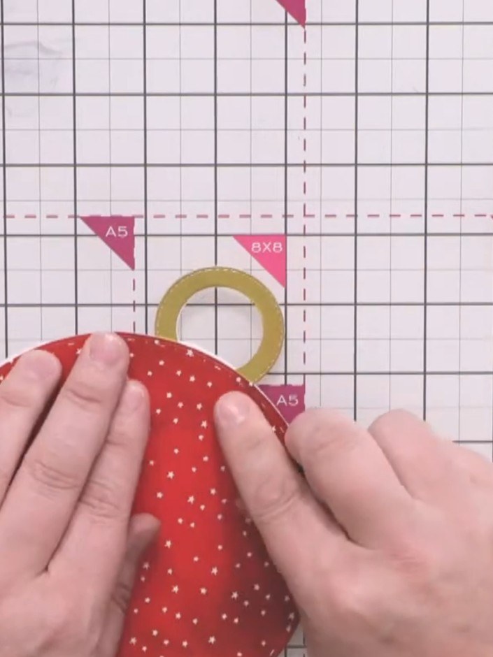Step 8: Glue the gold hoop to the top of the red bauble circle to create a hanging loop for the bubble card.
