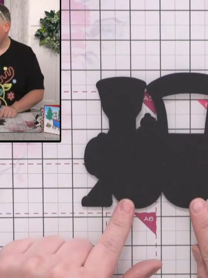 Step 1: Cut two pieces from black card using the large train die to create the front and back of your train engine.
