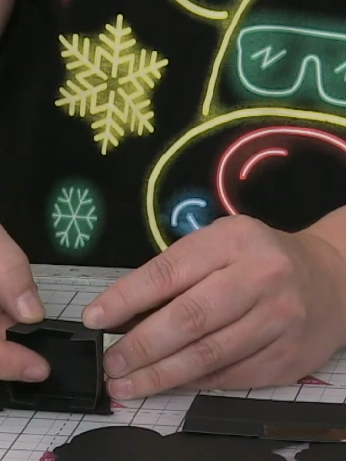 Step 10: Score the carriage base card at one-inch intervals and half-inch intervals to create the smaller box structure