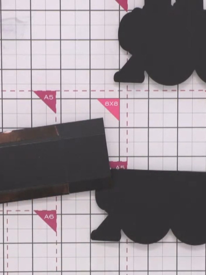 Step 8: Cut two carriage pieces from black card using the carriage die. These pieces will be the same size, unlike the