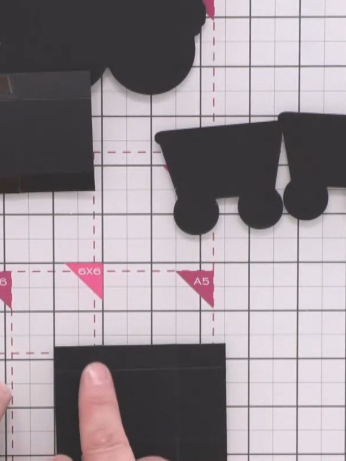 Step 9: Cut a piece of black card measuring 3.5 by 2.5 inches for each carriage's structural base.