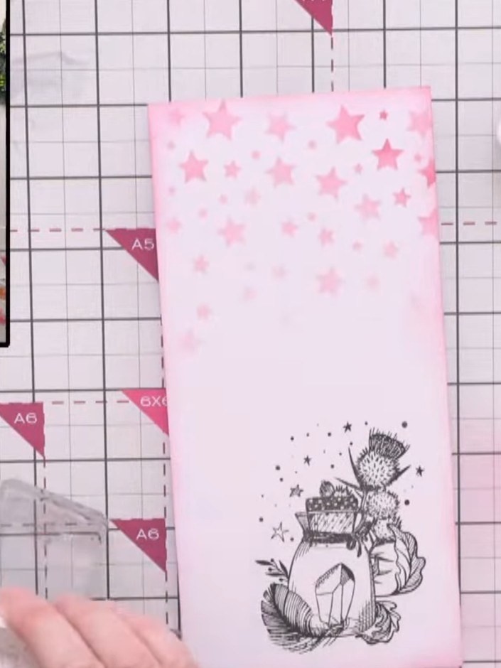 Step 7: Stamp the sentiment 'Make a Wish' in black ink onto the white panel. Position the stamp carefully to ensure it