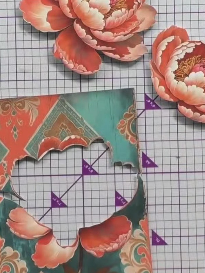 Step 3: Layer the three flower pieces on top of each other, starting with the largest at the base, to create dimension
