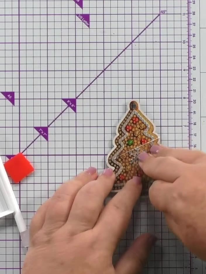 Step 1: Keep the protective film on the MDF Christmas tree decoration to protect the adhesive layer underneath. This w