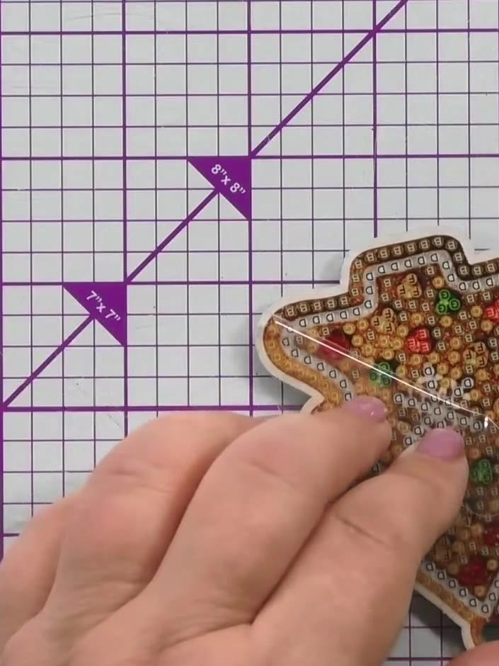 Step 10: Remember these decorations are double-sided, so complete both sides of the gingerbread man decoration with the