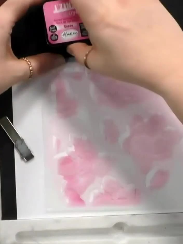 Step 5: Position the second numbered stencil over your work and apply a slightly darker shade of pink ink using a blen