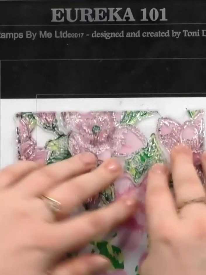 Step 7: Using a stamping platform and black ink, stamp the large magnolia floral image onto white cardstock. If needed