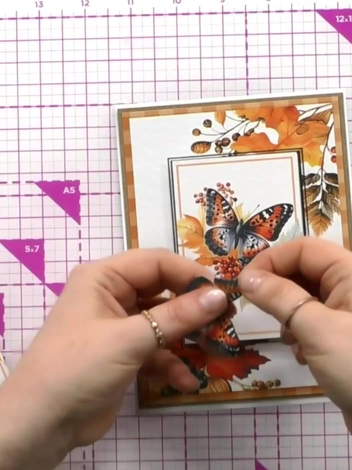 Step 8: Position the ATC (Artist Trading Card) topper in the centre of the matted board on your card front. Ensure it 