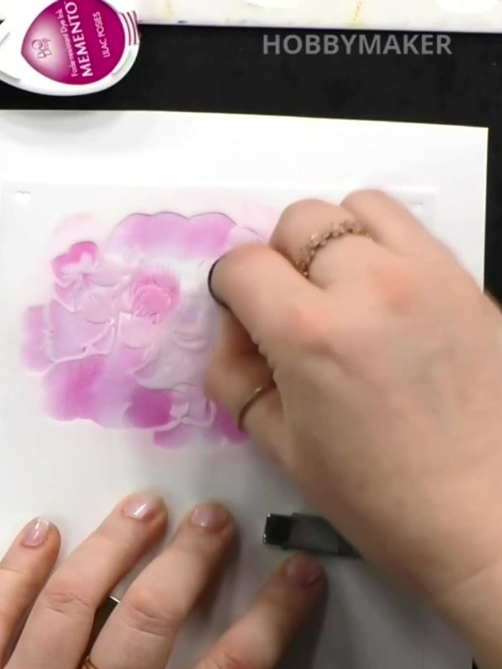 Step 4: Position the second numbered stencil over your work and apply a slightly darker shade of purple ink using the 