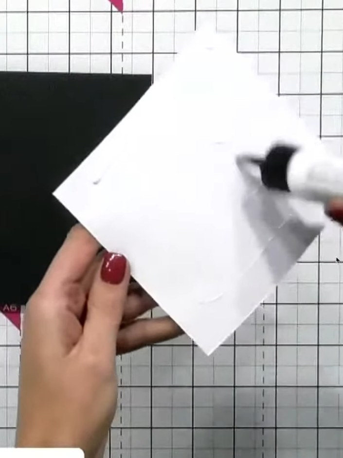 Step 1: Cut a piece of vellum and place it over the centre of your stencilled and glittered design to soften the brigh