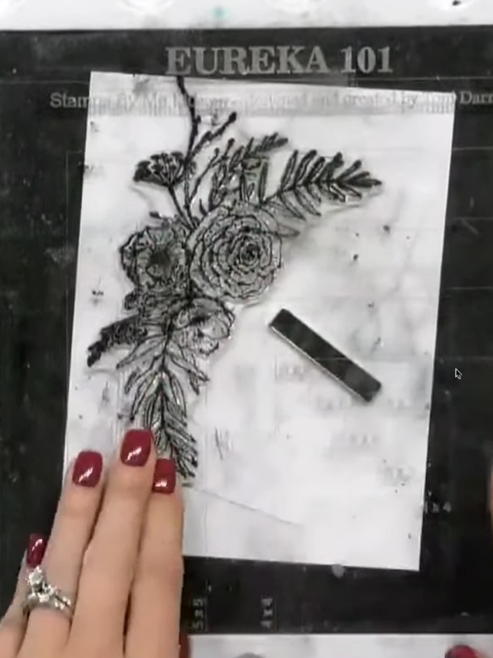 Step 3: Stamp a sentiment onto the second white layer, angling it to follow the curve of the thistle design. Press dow