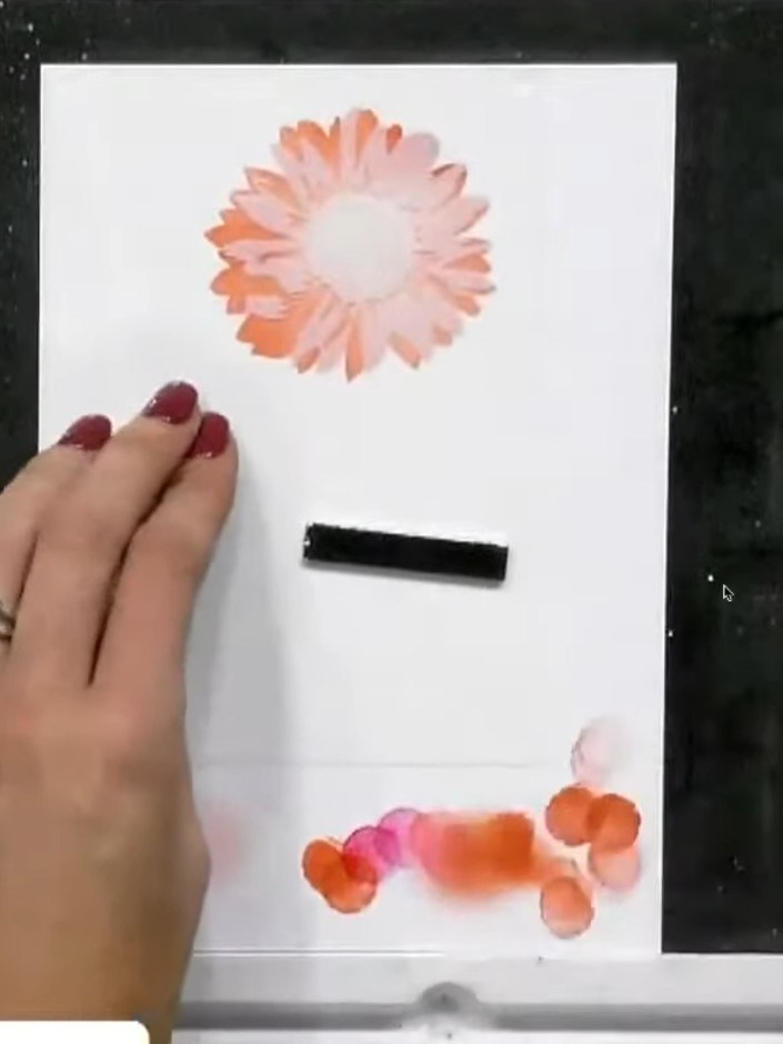 Step 6: Position stencil number four over your design. Using the blending brush, apply green ink to add shading and de