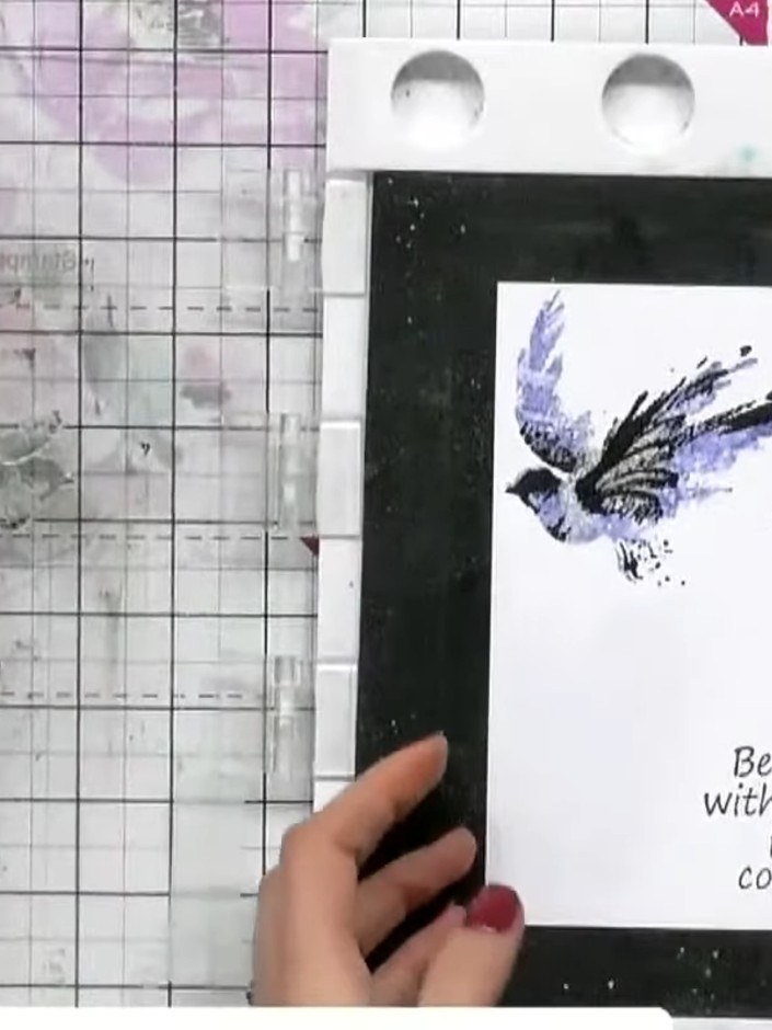 Step 6: Stamp the second bird image onto the card using black ink, positioning it to the right of the first bird. Add 