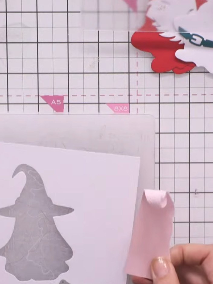 Step 4: Using a light grey ink pad, gently blend ink around the edges of the white cloth detail on the ghost to add su