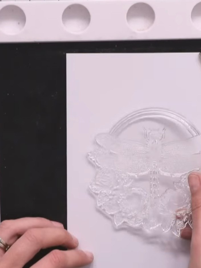 Step 2: Ink up the large dragonfly stamp thoroughly with sticky embossing ink, stamping it twice onto white cardstock 