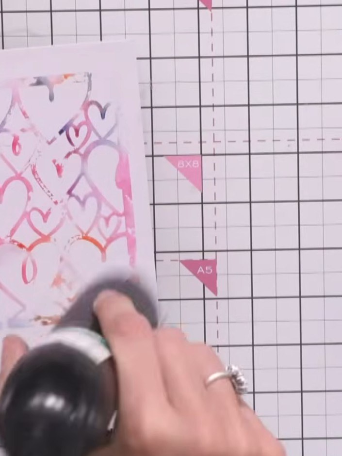 Step 9: Cut a rectangular panel from the stencilled heart background using a guillotine or craft knife and ruler on yo