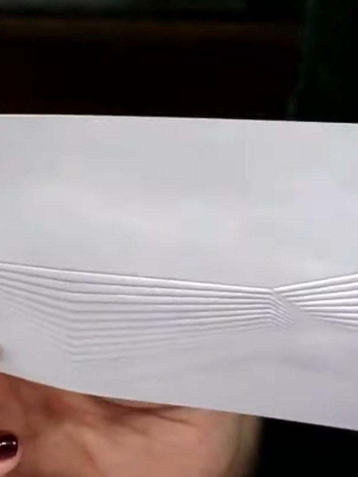 Step 4: Fold your white card in half at the top to create a landscape card base.