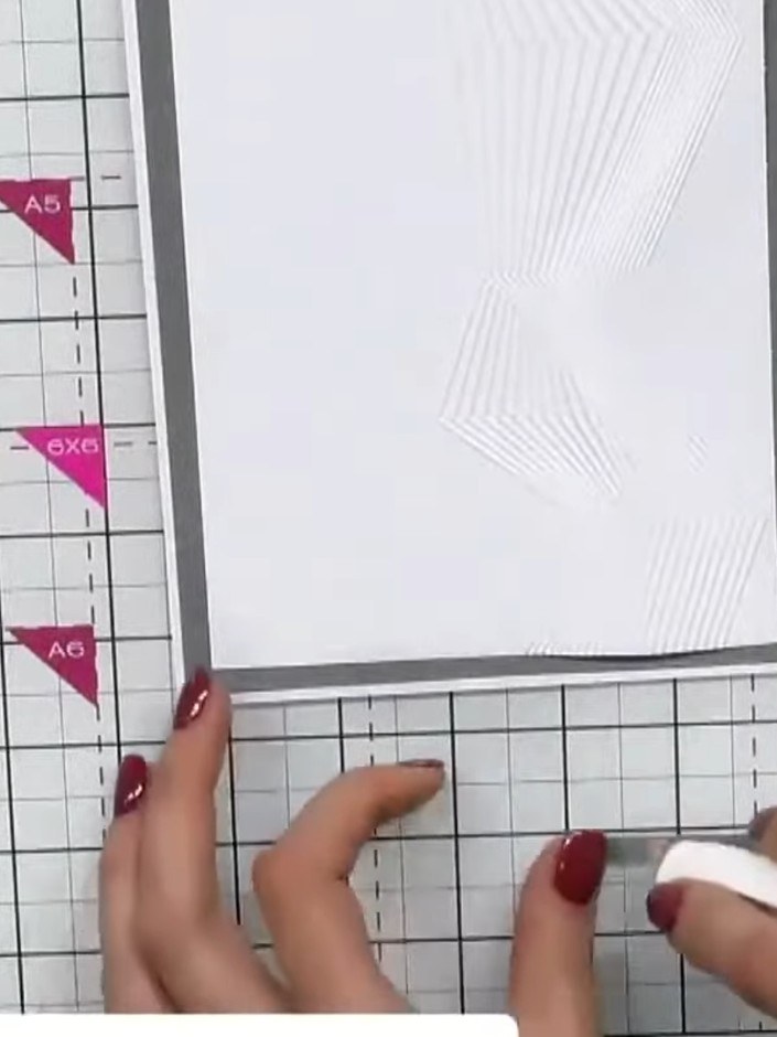 Step 7: Leave the embossed geometric design uncoloured to maintain a clean and simple aesthetic. The textured linen ca