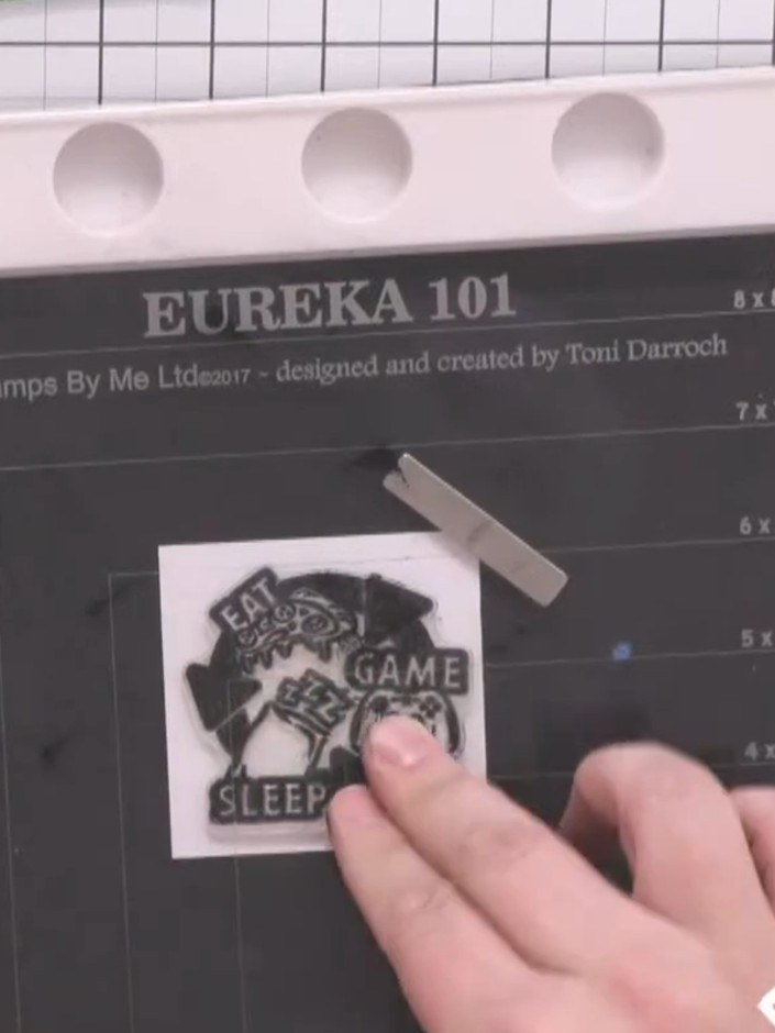 Step 10: Stamp a sentiment or decorative element in black ink onto a small white square of cardstock.