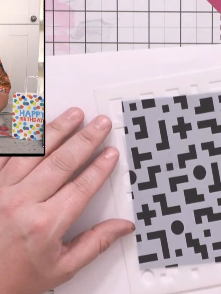 Step 2: Position the pixel pattern stencil on the black card and apply embossing ink through the stencil using an embo