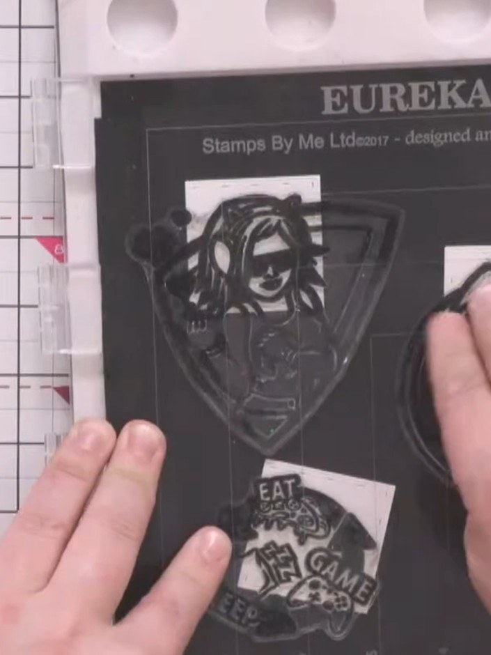 Step 6: Press the inked stamps from the Eureka 101 stamp set firmly onto white cardstock to transfer the character des