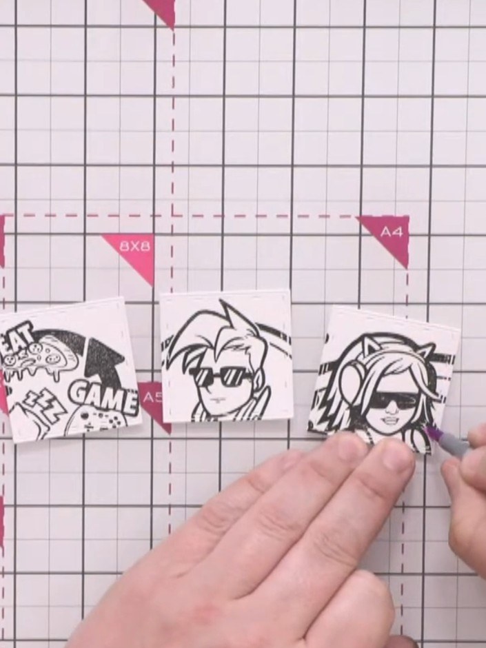 Step 8: Using an alcohol marker in a colour complementary to the pink background, colour around the character outlines