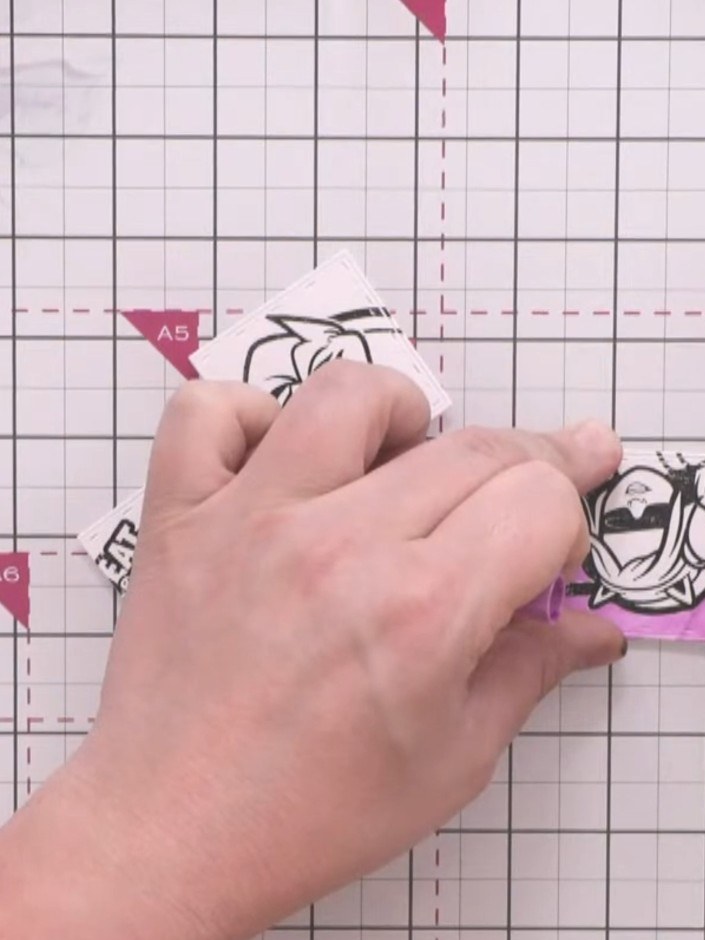 Step 9: Continue colouring the background areas around all three stamped character designs using your colouring pen, c