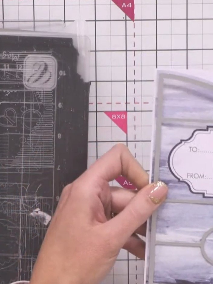 Step 2: Position the large die on your chosen patterned paper on the cutting mat, ensuring it is aligned correctly wit