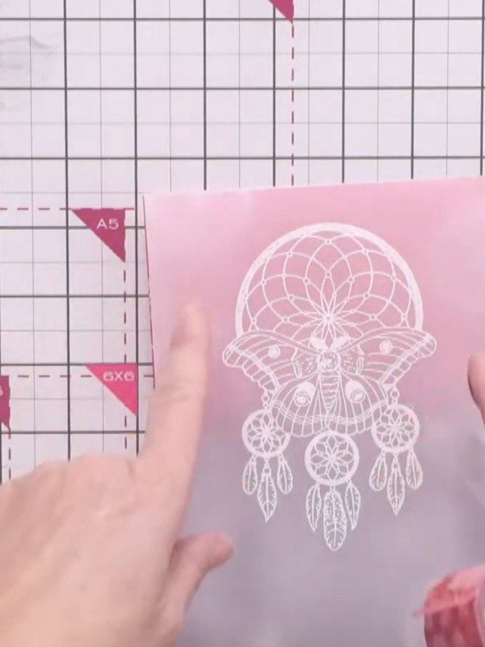 Step 11: Apply washi tape down each side of the vellum panel to frame the dream catcher design and secure the vellum ed
